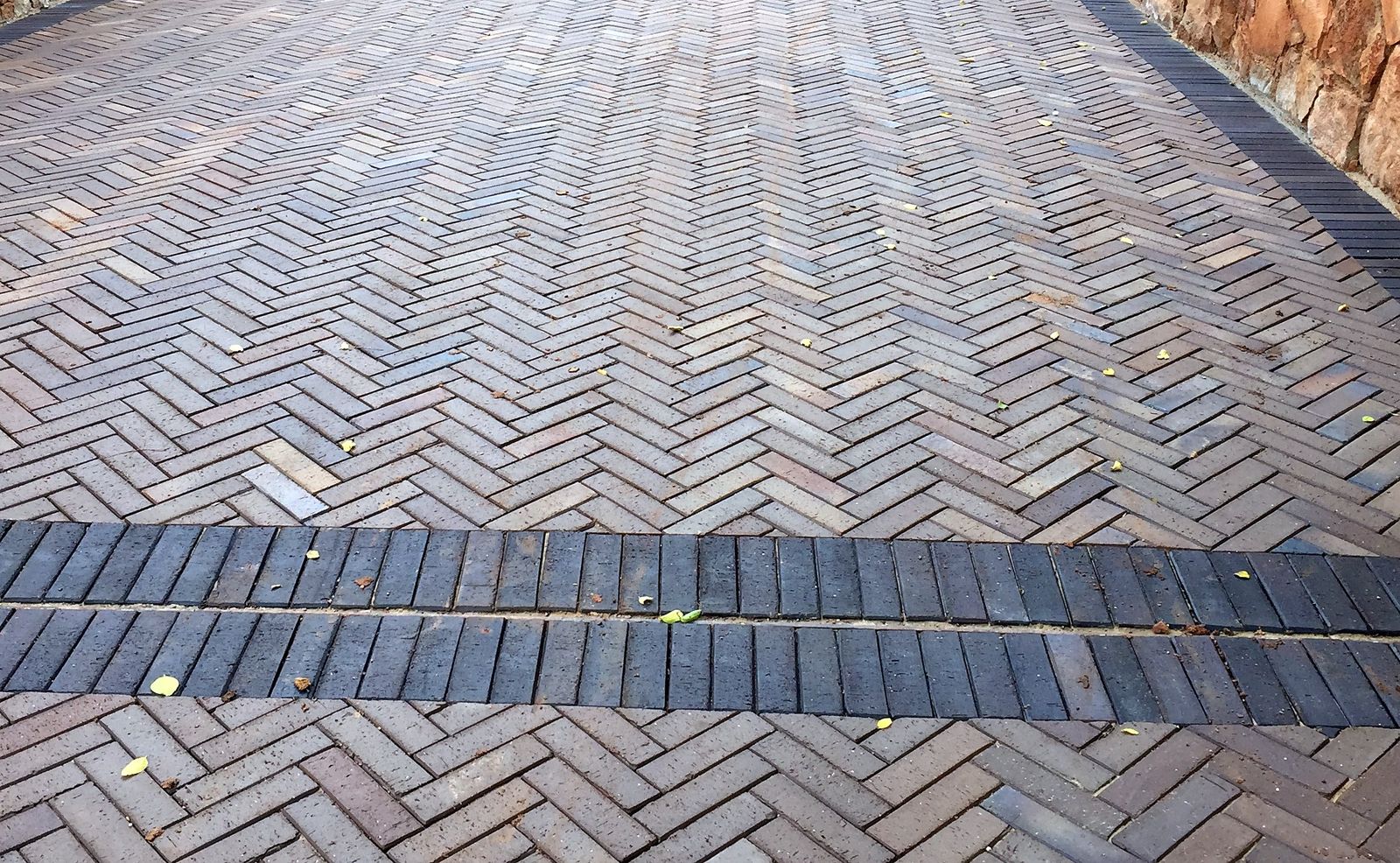Close-up of finished herringbone paving craftsmanship