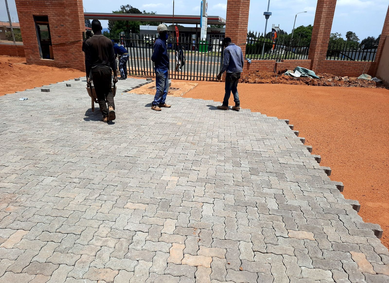 Grey curb edge restraint bordering newly laid paving
