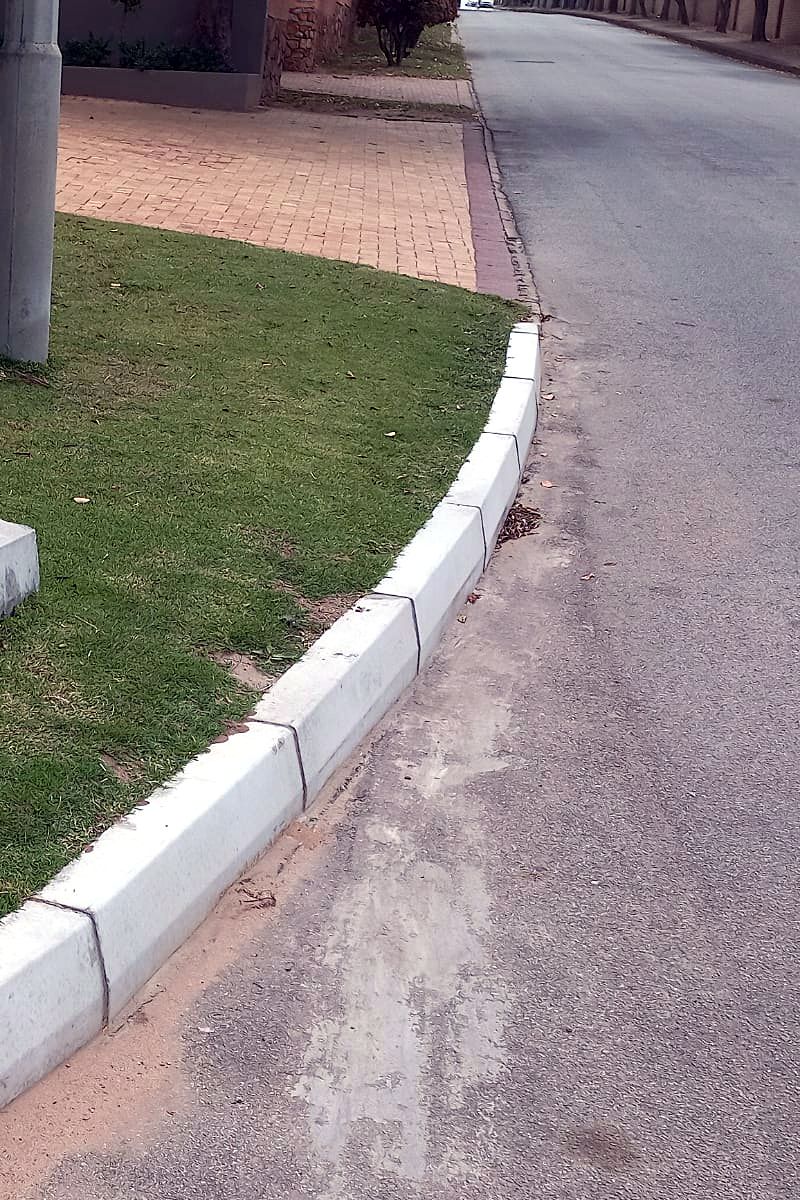 Precast concrete kerb edging along a residential estate road